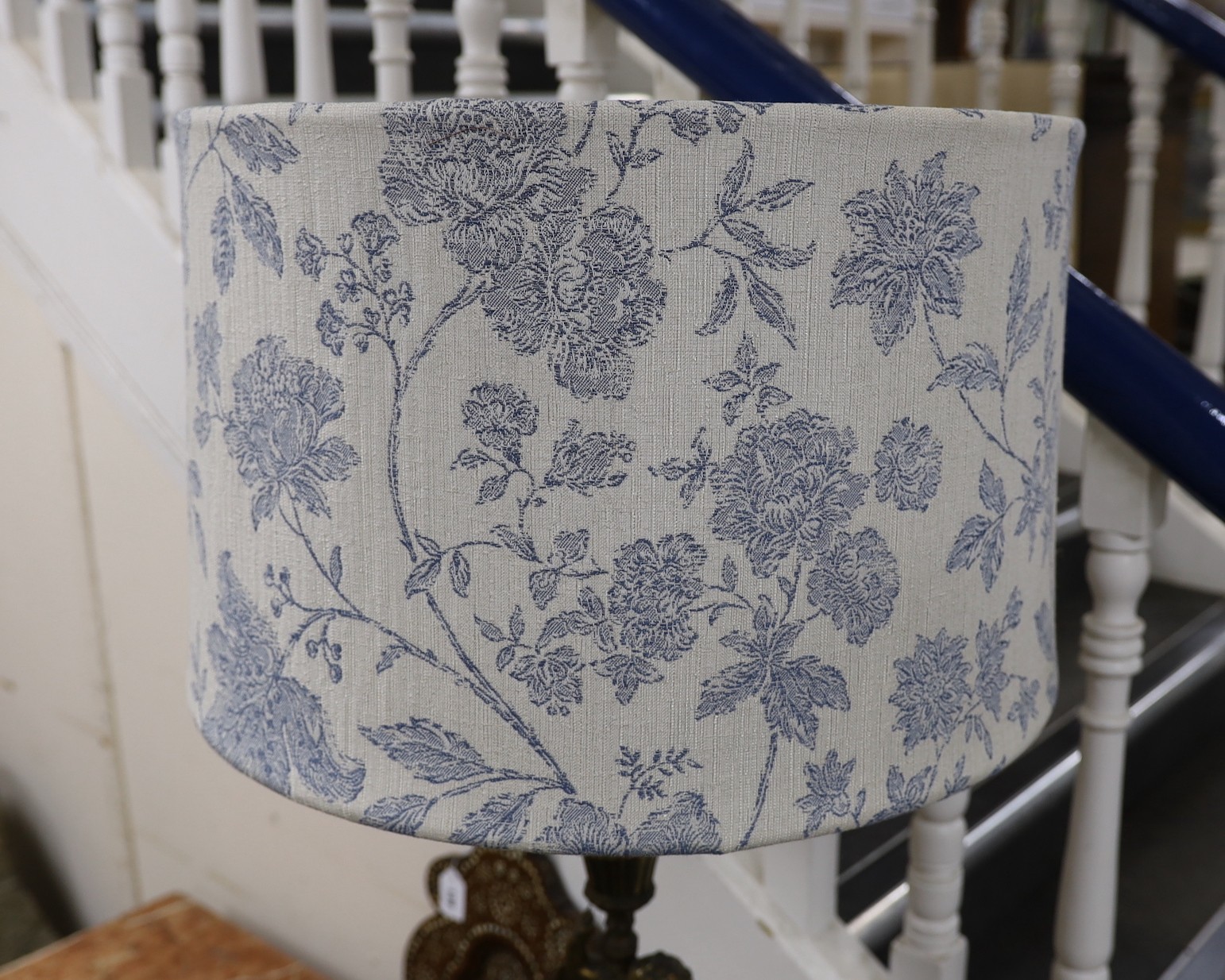 A large cherub stem cast brass five light table lamp with shade, 99cms high including shade